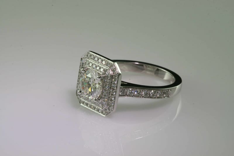 A diamond halo engagement ring
