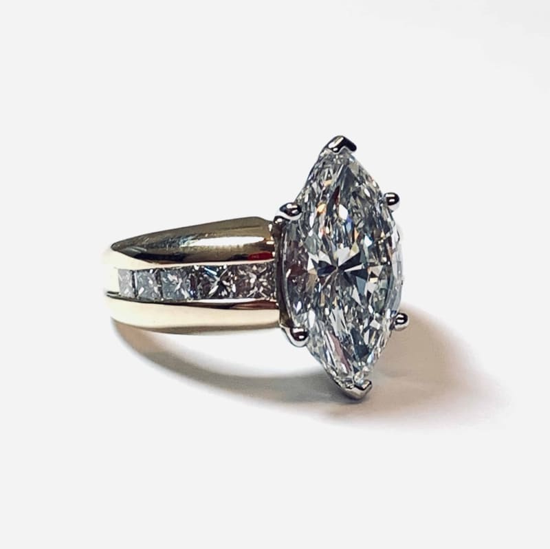 Marquise diamond ring with a channel-set band