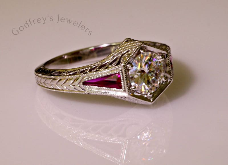 Vintage-style engraved ring with rubies and a center diamond